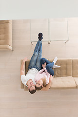 Image showing Young couple on the sofa watching television top view