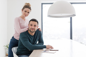 Image showing couple hugging in their new home