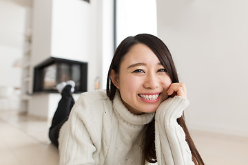 Image showing young Asian woman using laptop on the floor