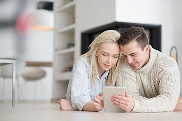 Image showing Young Couple using digital tablet on cold winter day