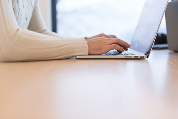 Image showing businessman working using a laptop in startup office