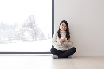 Image showing asian woman enjoying morning coffee