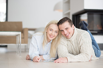 Image showing Young Couple using digital tablet on cold winter day