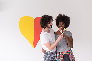 Image showing couple with painted heart on wall