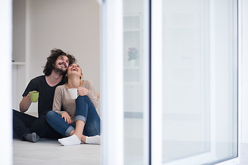 Image showing young couple in their new home