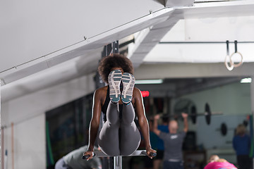 Image showing black woman doing parallel bars Exercise