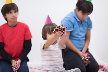 Image showing kids  blowing confetti