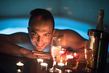 Image showing man relaxing in the jacuzzi