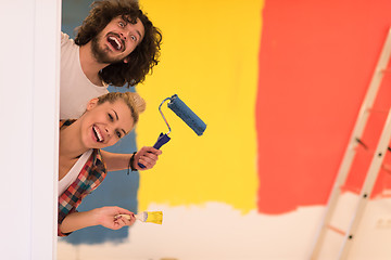 Image showing portrait of a couple painting interior wall