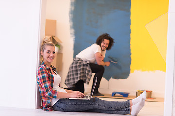 Image showing Happy couple doing home renovations