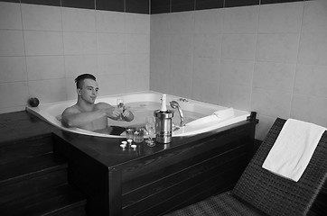 Image showing man relaxing in the jacuzzi