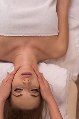 Image showing woman receiving a head massage