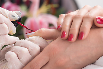 Image showing Woman hands receiving a manicure