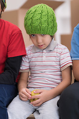 Image showing boys with cardboard boxes around them