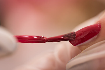 Image showing Woman hands receiving a manicure