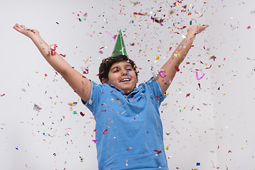 Image showing kid blowing confetti