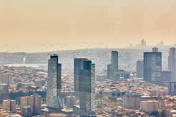 Image showing Istanbul, Turkey - 1 April, 2017: Urban landscape of European side of Istanbul and Bosphorus Strait on a horizon. Modern part of city with business towers of international corporations, skyscrapers an