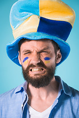 Image showing The football fan over blue