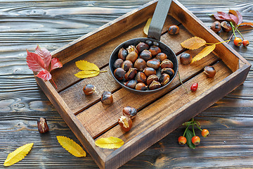 Image showing Delicious roasted chestnuts in a cast iron skillet.