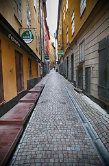 Image showing STOCKHOLM, SWEDEN - AUGUST 20, 2016: View of narrow street and c