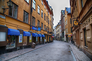 Image showing STOCKHOLM, SWEDEN - AUGUST 20, 2016: View of narrow street and c