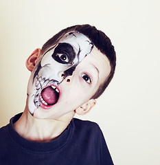 Image showing little cute boy with facepaint like skeleton to celebrate hallow