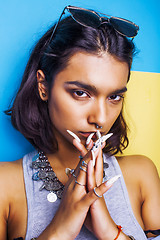 Image showing lifestyle people concept. young pretty smiling indian girl with long nails wearing lot of jewelry rings, asian summer happy cool