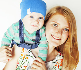 Image showing young beauty mother with cute baby, red head happy modern family