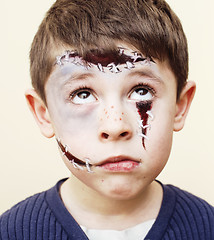 Image showing little cute boy with facepaint like zombie apocalypse at hallowe