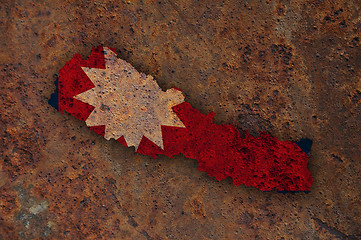 Image showing Map and flag of Nepal on rusty metal