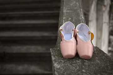 Image showing Pointe shoes for a classical ballerina, close-up on concrete