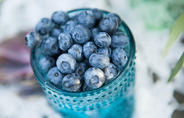 Image showing Useful blueberry berry in a vintage cup