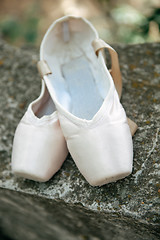 Image showing Pointe shoes for a classical ballerina, close-up on concrete