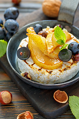 Image showing Grilled cheese with pear and black grapes closeup.