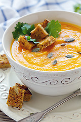 Image showing Bowl with spicy pumpkin soup and croutons.