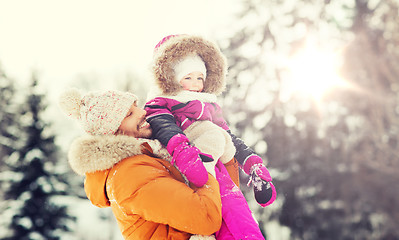 Image showing happy family in winter clothes outdoors