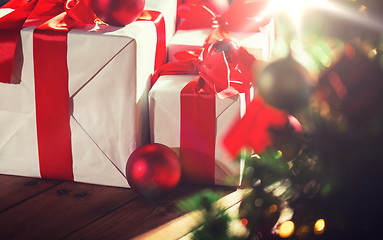 Image showing gift boxes and red balls under christmas tree