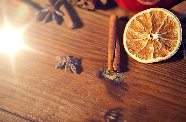 Image showing cinnamon, anise and dried orange on wooden board