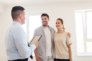 Image showing couple and realtor with tablet pc at new home