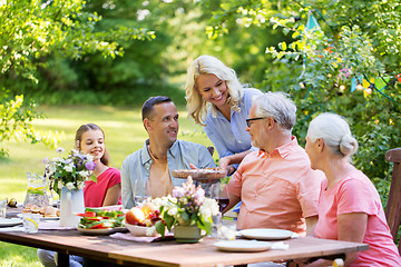 Image showing happy family having dinner or summer garden party