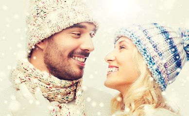 Image showing smiling couple in winter clothes hugging