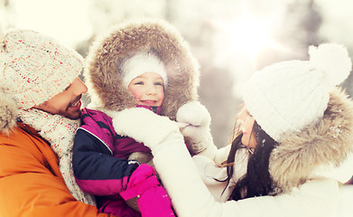 Image showing happy family with child in winter clothes outdoors