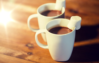 Image showing cups of hot chocolate with marshmallow on wood