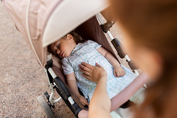 Image showing mother with child sleeping in stroller