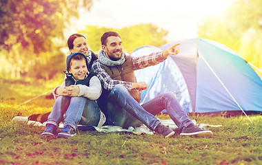 Image showing happy family with tent at camp site