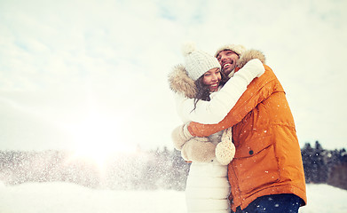 Image showing happy couple hugging and laughing in winter