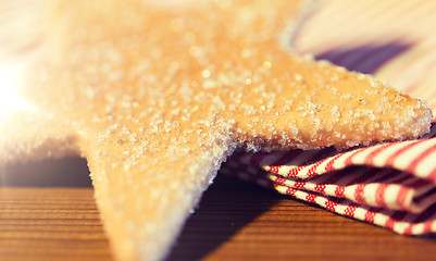 Image showing close up of star gingerbread cookie and towel