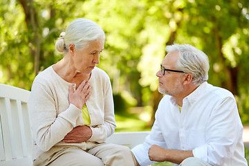 Image showing senior woman feeling sick at summer park