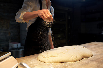 Image showing chef or baker making bread dough at bakery