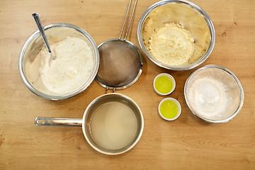 Image showing bowls with flour and egg whites at bakery kitchen